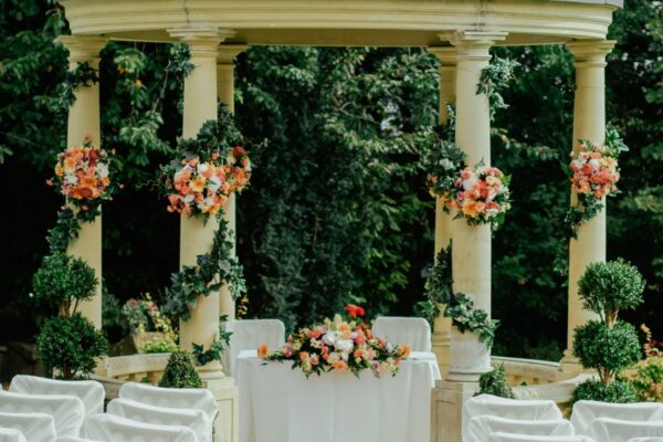 Outdoor wedding ceremony gazebo surrounded by lush greenery perfect for mountain weddings